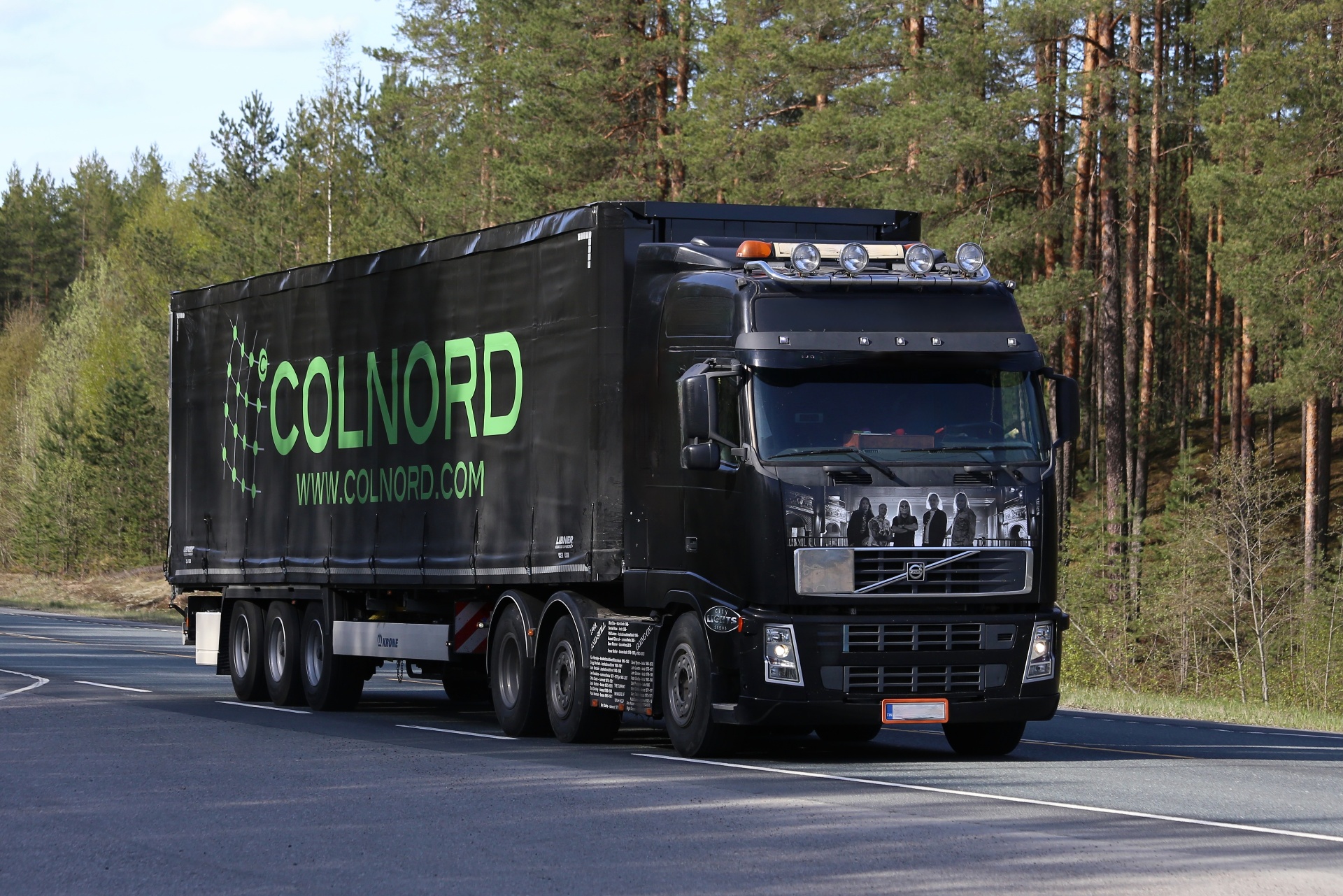 Colnord Volvo FH truck with branded curtainside trailer on a Finnish highway